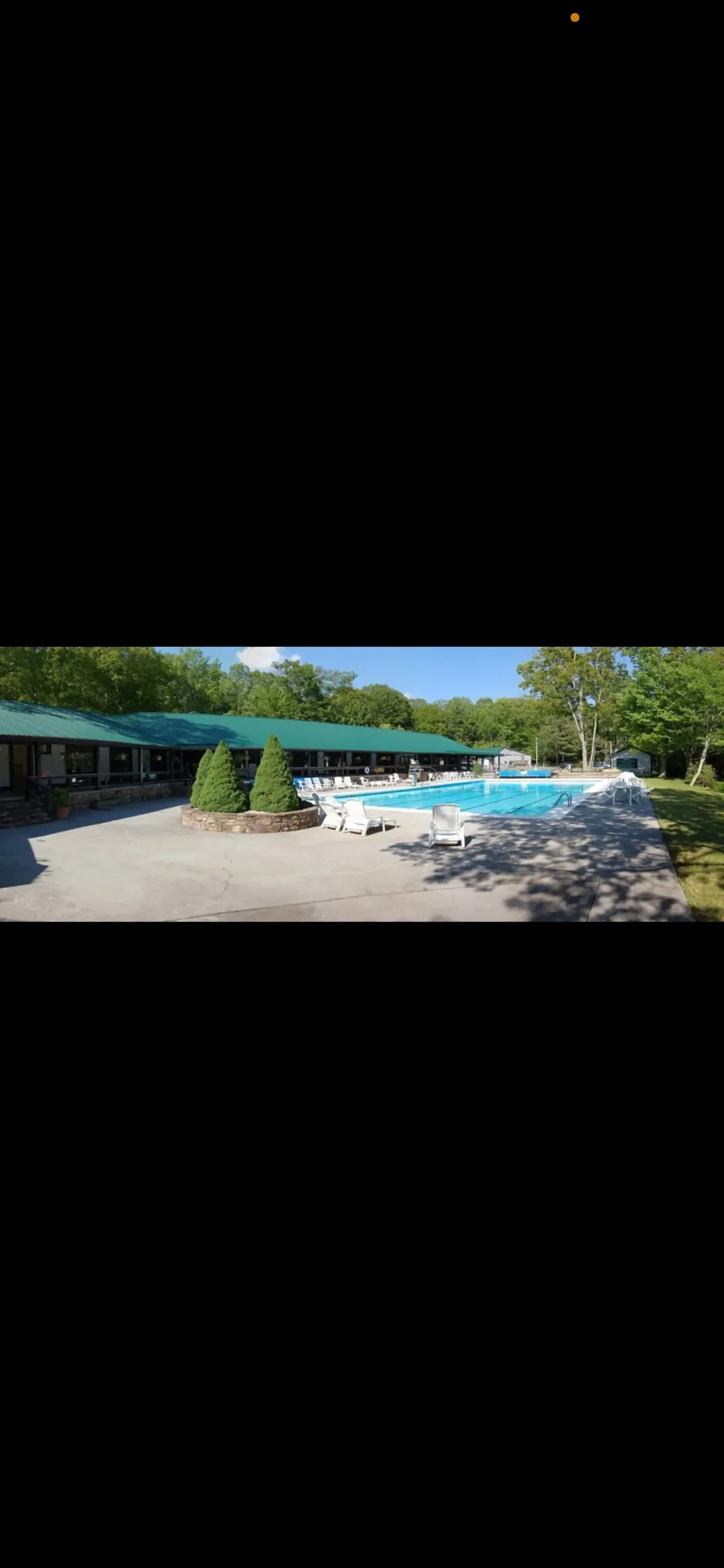 A bright, inviting scene featuring a sparkling outdoor swimming pool surrounded by green bushes and sun loungers, evoking the lively atmosphere of summer afternoons. The pool is clearly a hub for family activities and relaxation, with space for both kids and adults to unwind.